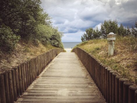 a picture of the walkway to jupiter beach in jupiter, florida